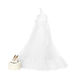 Photo of Mannequin with beautiful wedding dress and shoes isolated on white