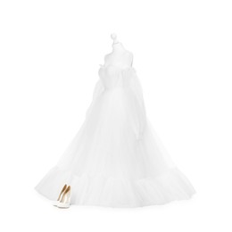 Photo of Mannequin with beautiful wedding dress and shoes isolated on white