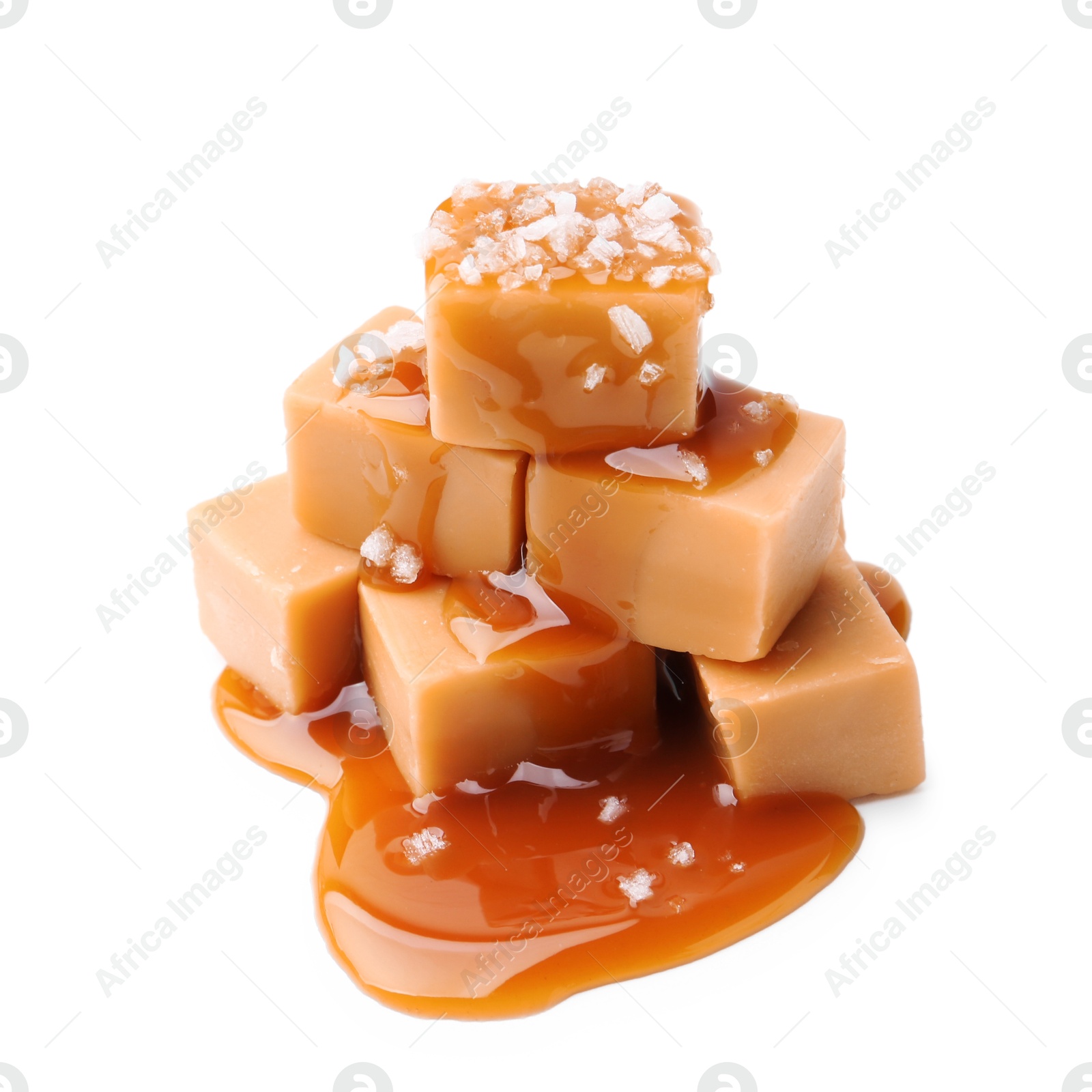 Photo of Tasty candies with salted caramel isolated on white