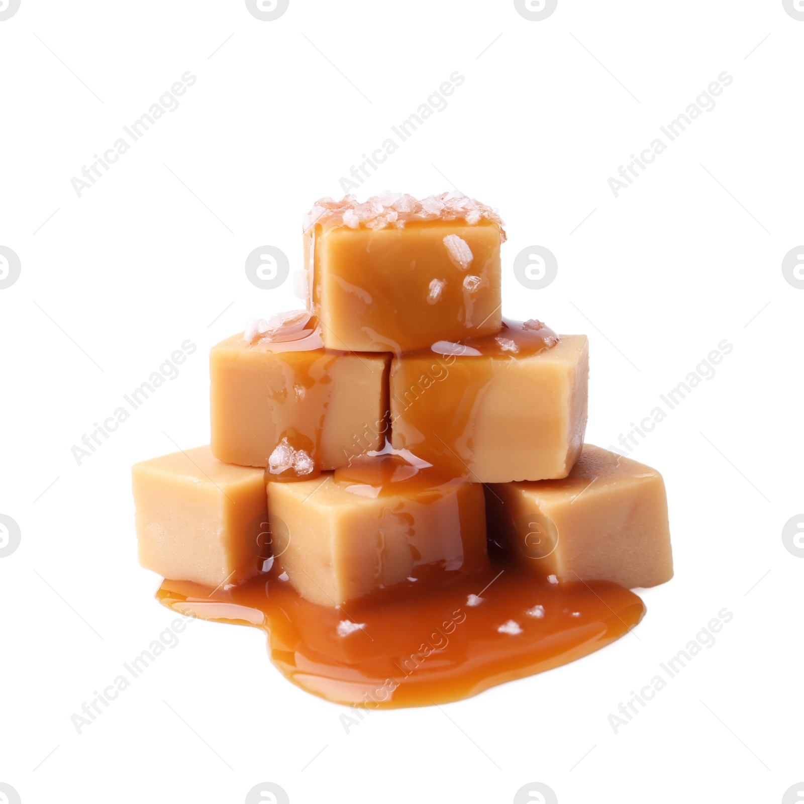 Photo of Tasty candies with salted caramel isolated on white