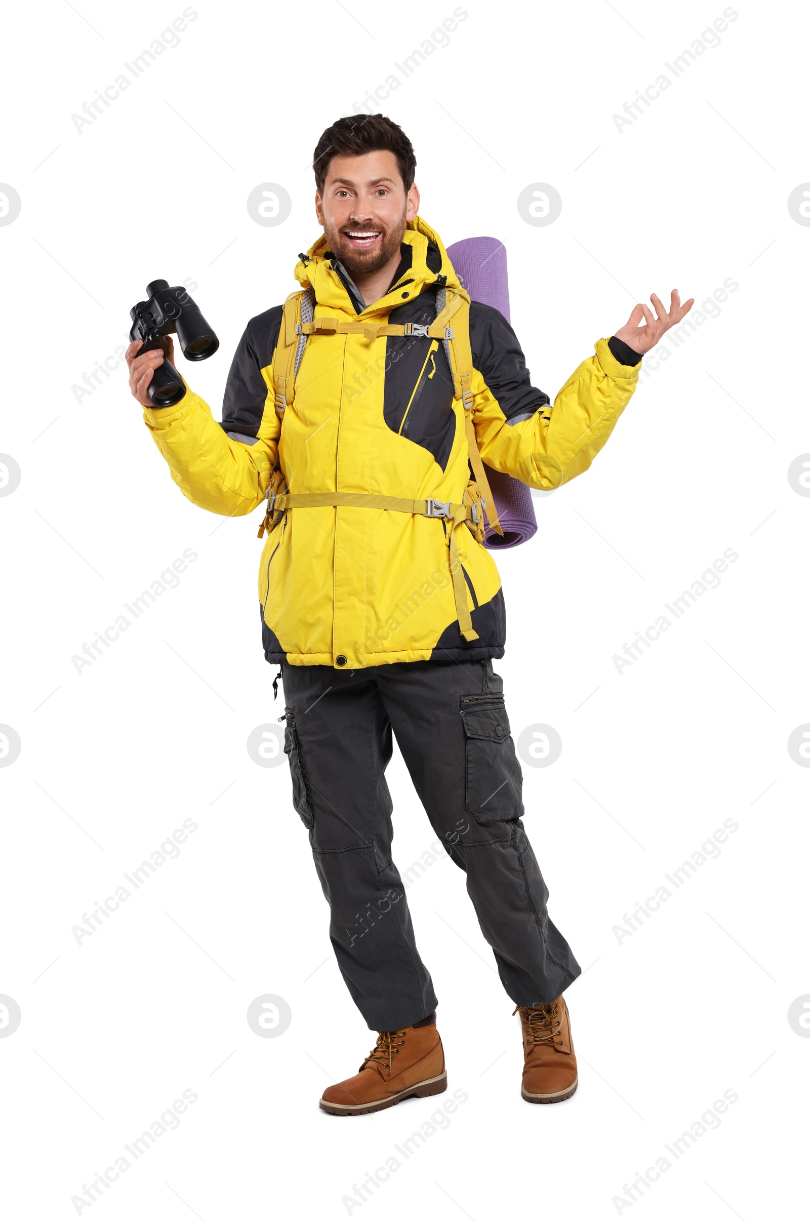 Photo of Happy man with backpack and binoculars on white background. Active tourism