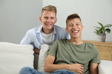 Photo of Happy brothers spending time together at home