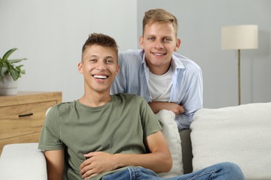 Happy brothers spending time together at home