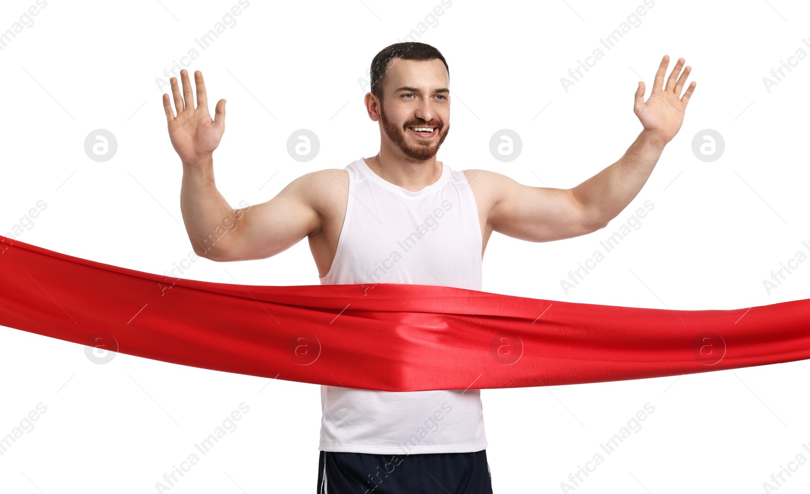 Photo of Handsome young man crossing red finish line on white background