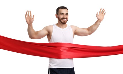 Photo of Handsome young man crossing red finish line on white background