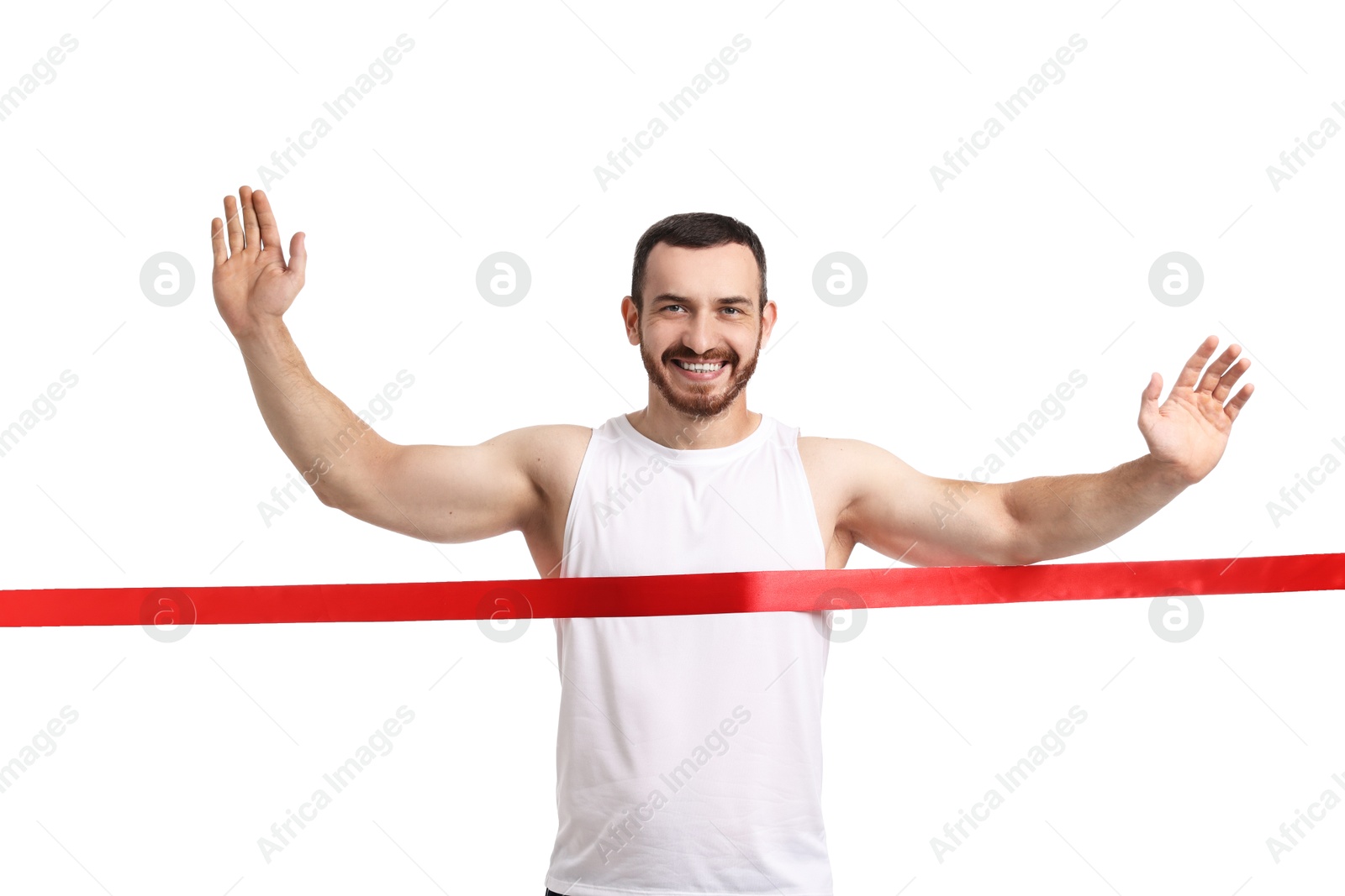 Photo of Handsome young man crossing red finish line on white background