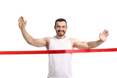 Photo of Handsome young man crossing red finish line on white background