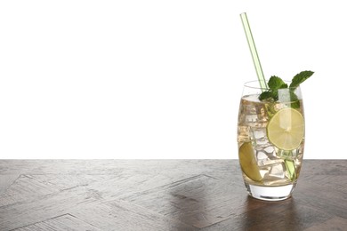 Glass of tasty refreshing drink and straw on wooden table against white background, space for text