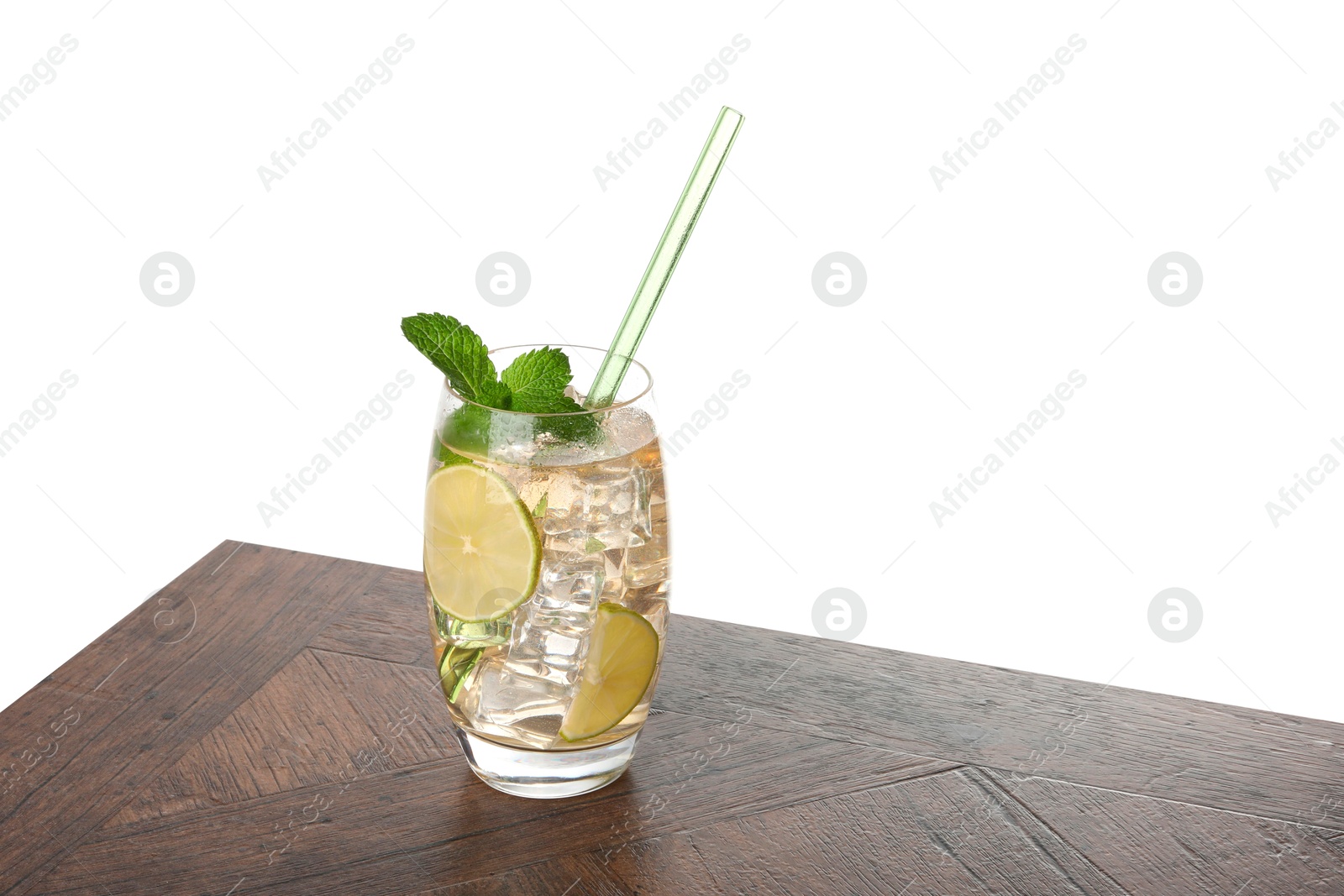 Photo of Glass of tasty refreshing drink and straw on wooden table against white background