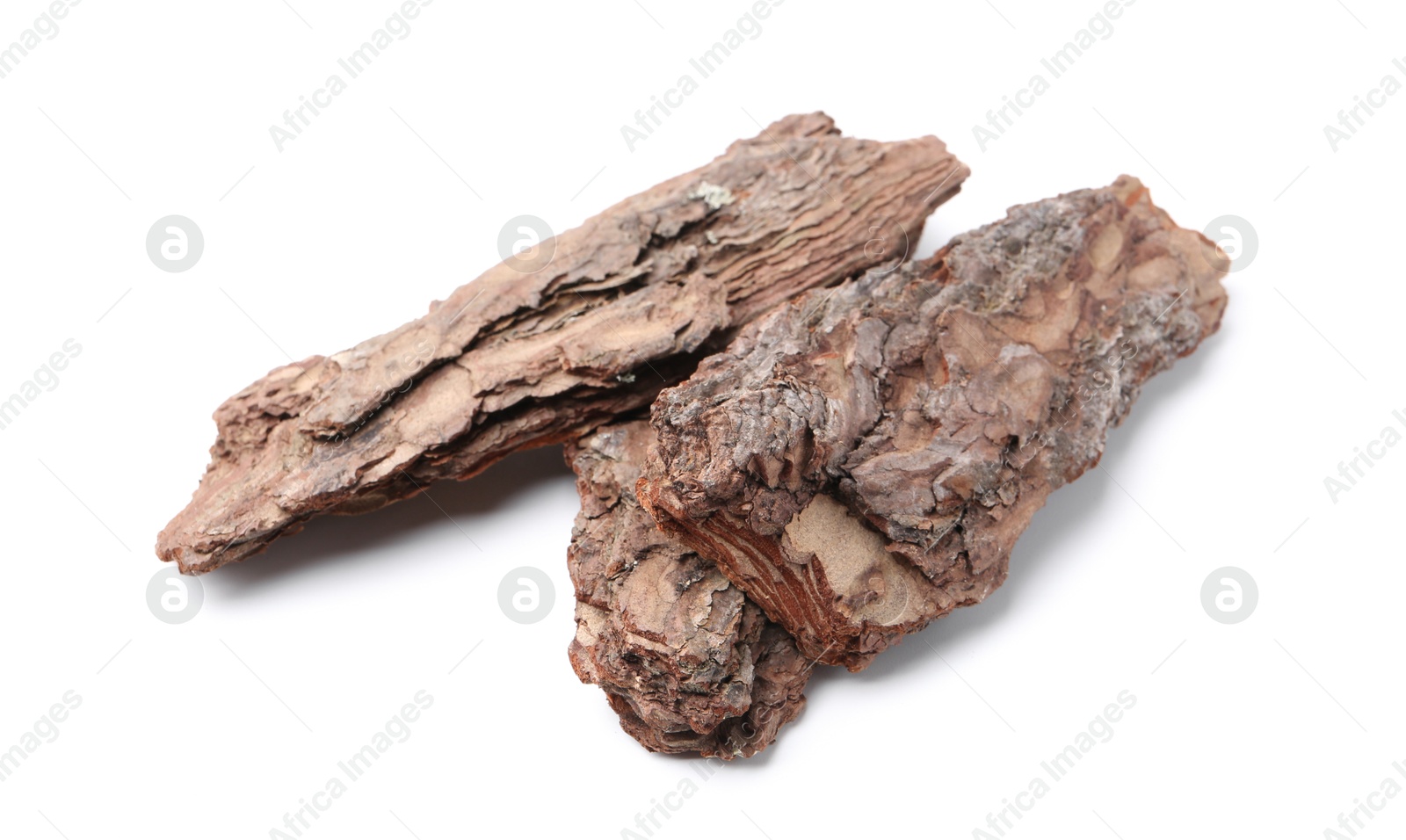 Photo of Pieces of tree bark on white background