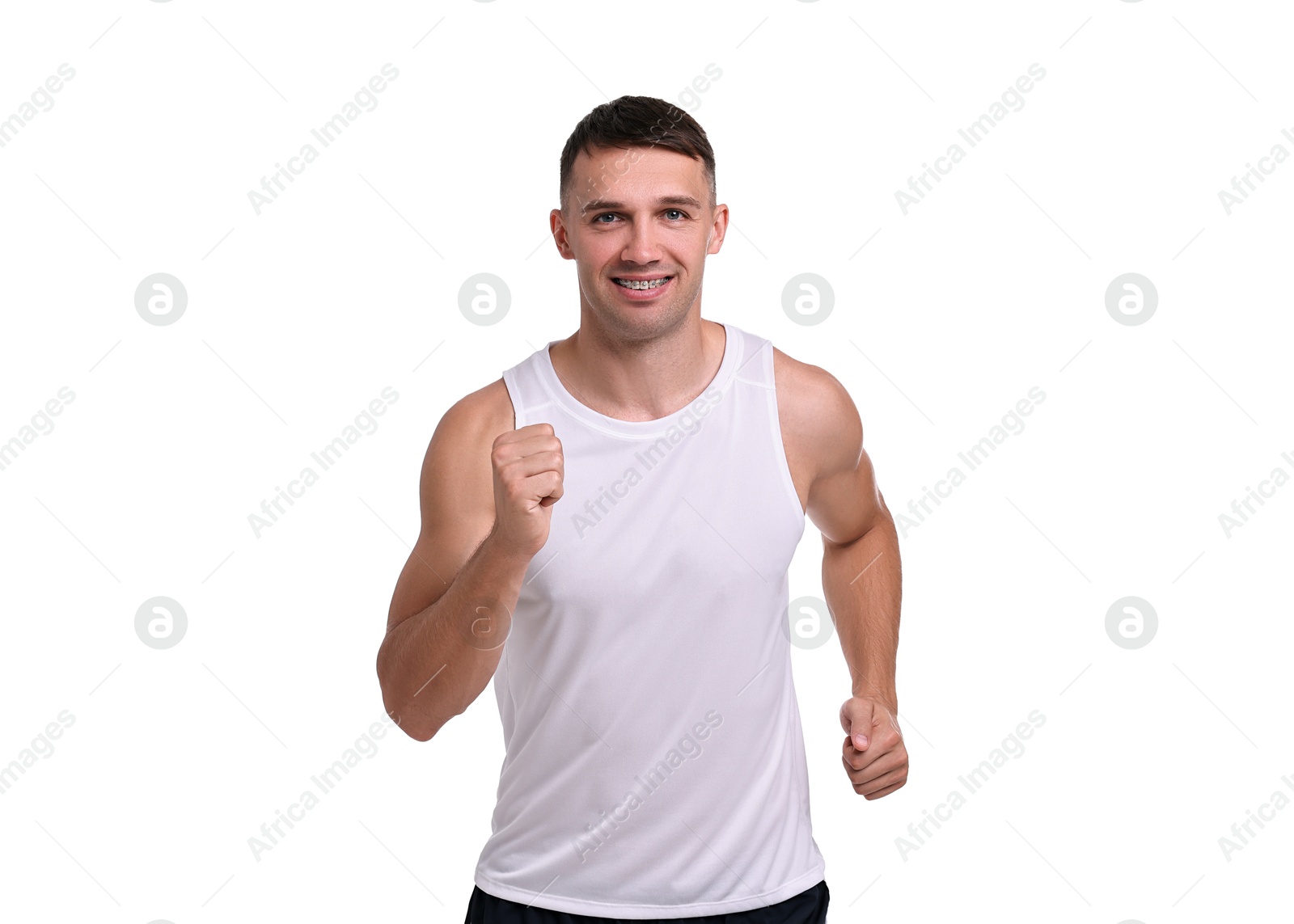 Photo of Man in sportswear running on white background