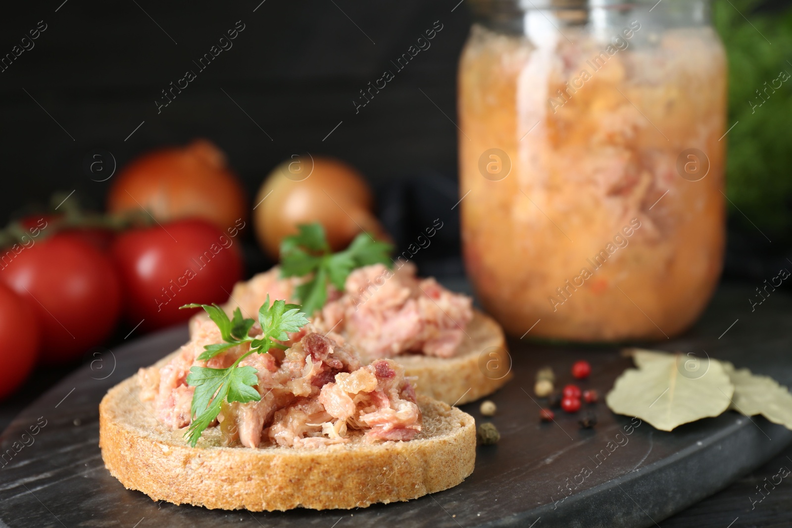 Photo of Sandwiches with canned meat and spices on table, closeup