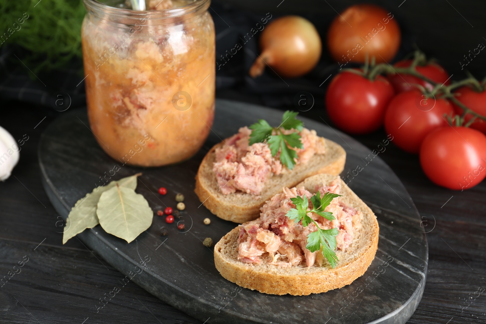 Photo of Sandwiches with canned meat served on wooden table, closeup