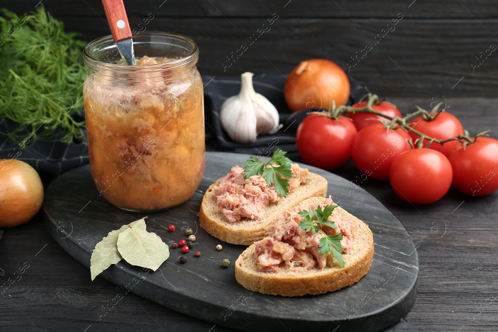 Photo of Sandwiches with canned meat served on wooden table