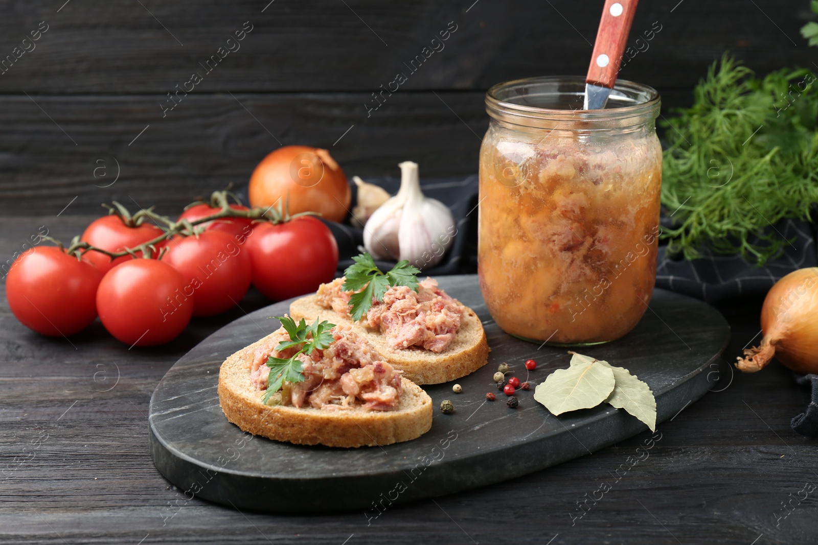 Photo of Sandwiches with canned meat served on wooden table