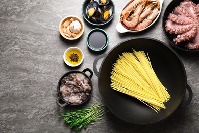 Photo of Ingredients for wok on grey table, flat lay