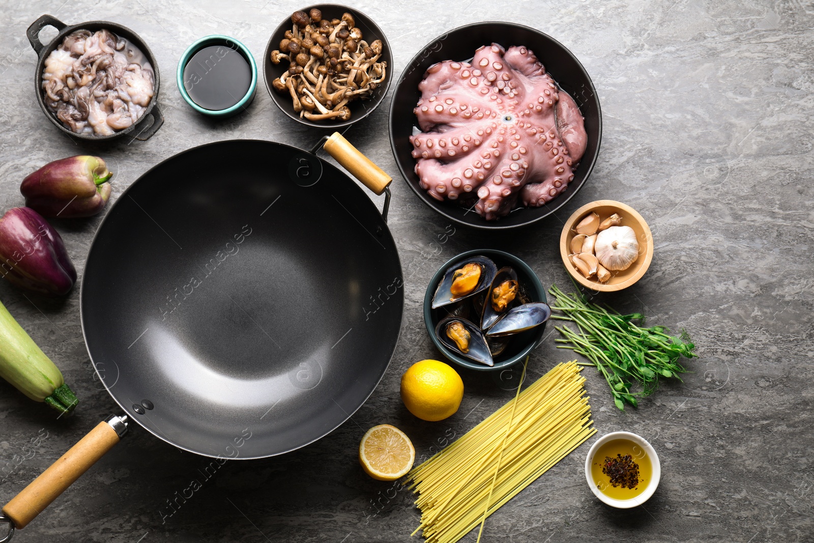 Photo of Ingredients for wok on grey table, flat lay