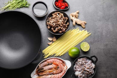 Photo of Ingredients for wok on grey table, flat lay