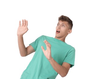 Portrait of scared young man on white background