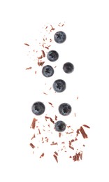 Photo of Fresh blueberries and crushed chocolate pieces isolated on white