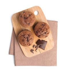 Photo of Delicious sweet muffins with chocolate chips isolated on white, top view