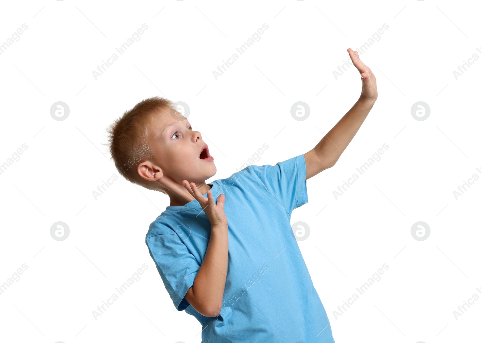 Photo of Portrait of scared little boy on white background