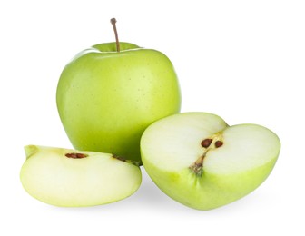 Photo of Whole and cut fresh green apples isolated on white