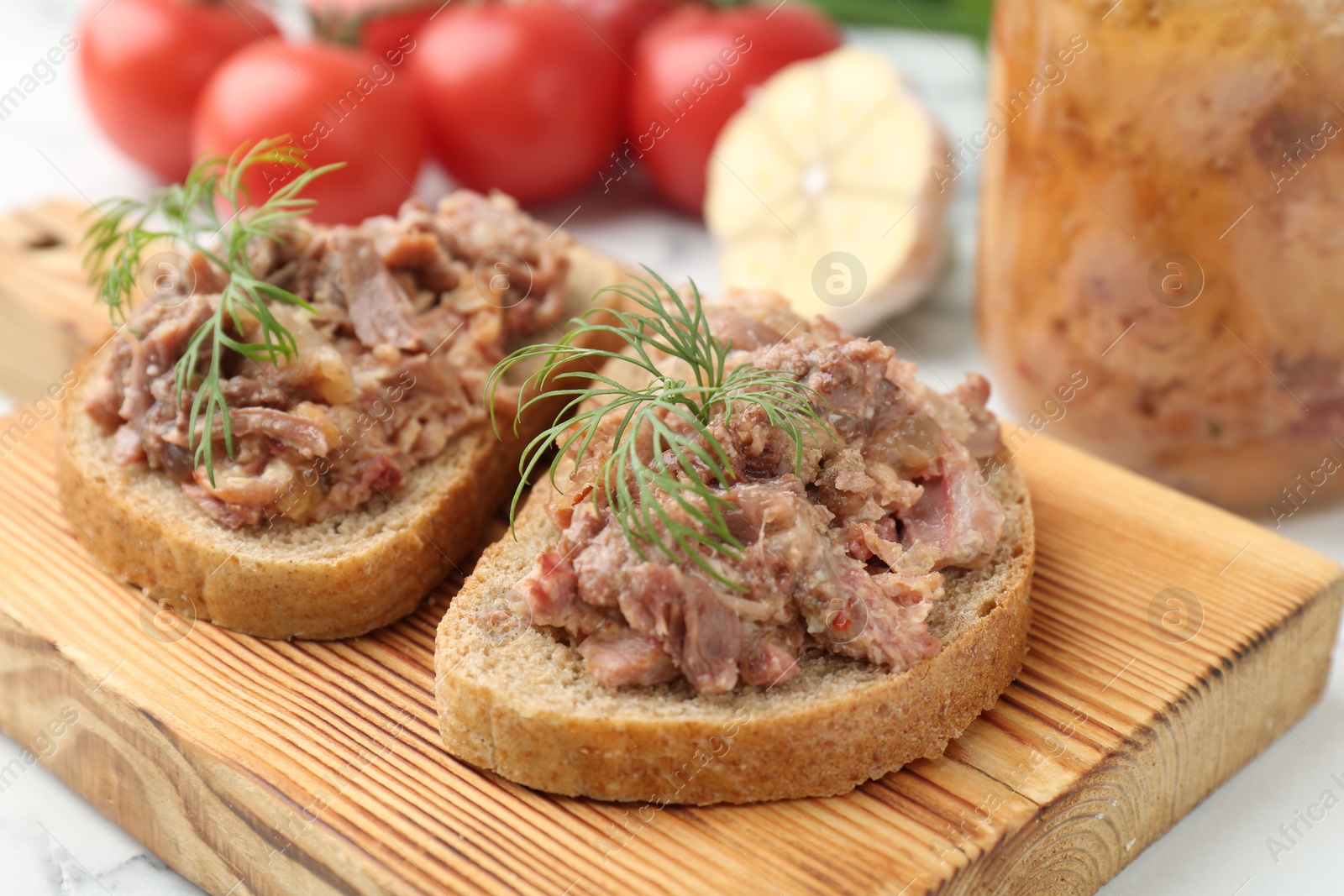 Photo of Sandwiches with canned meat and dill on table, closeup