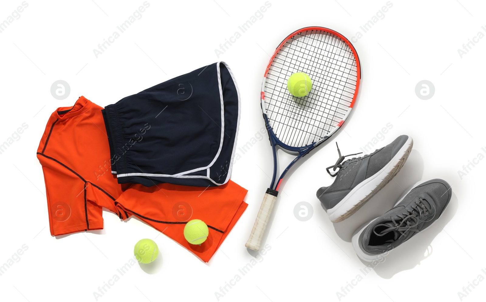 Photo of Tennis racket, balls, sneakers and sportswear on light background, flat lay