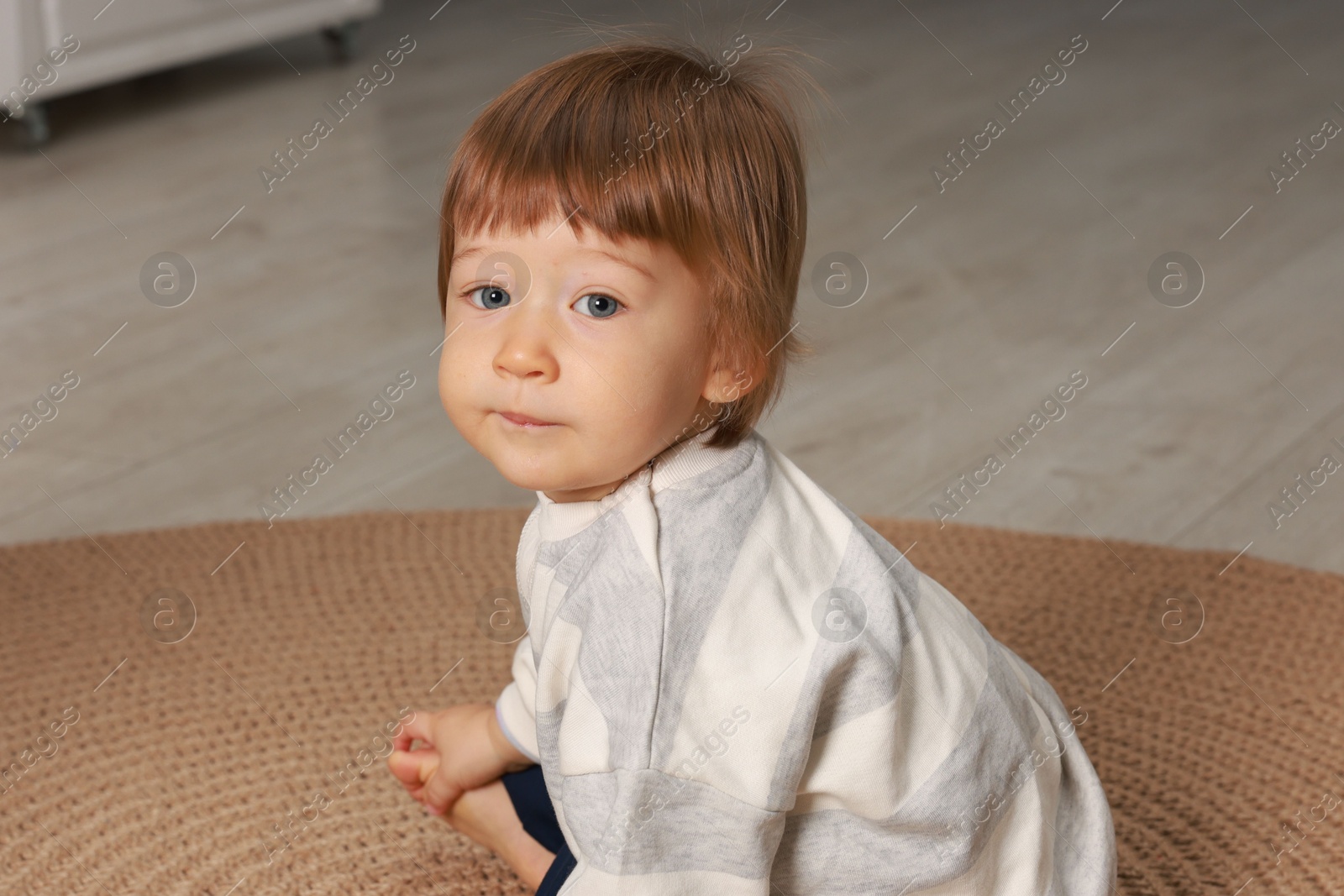 Photo of Portrait of little boy on floor indoors