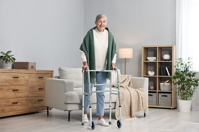 Photo of Senior woman with walking frame at home