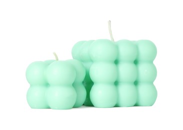 Photo of Beautiful turquoise bubble candles isolated on white