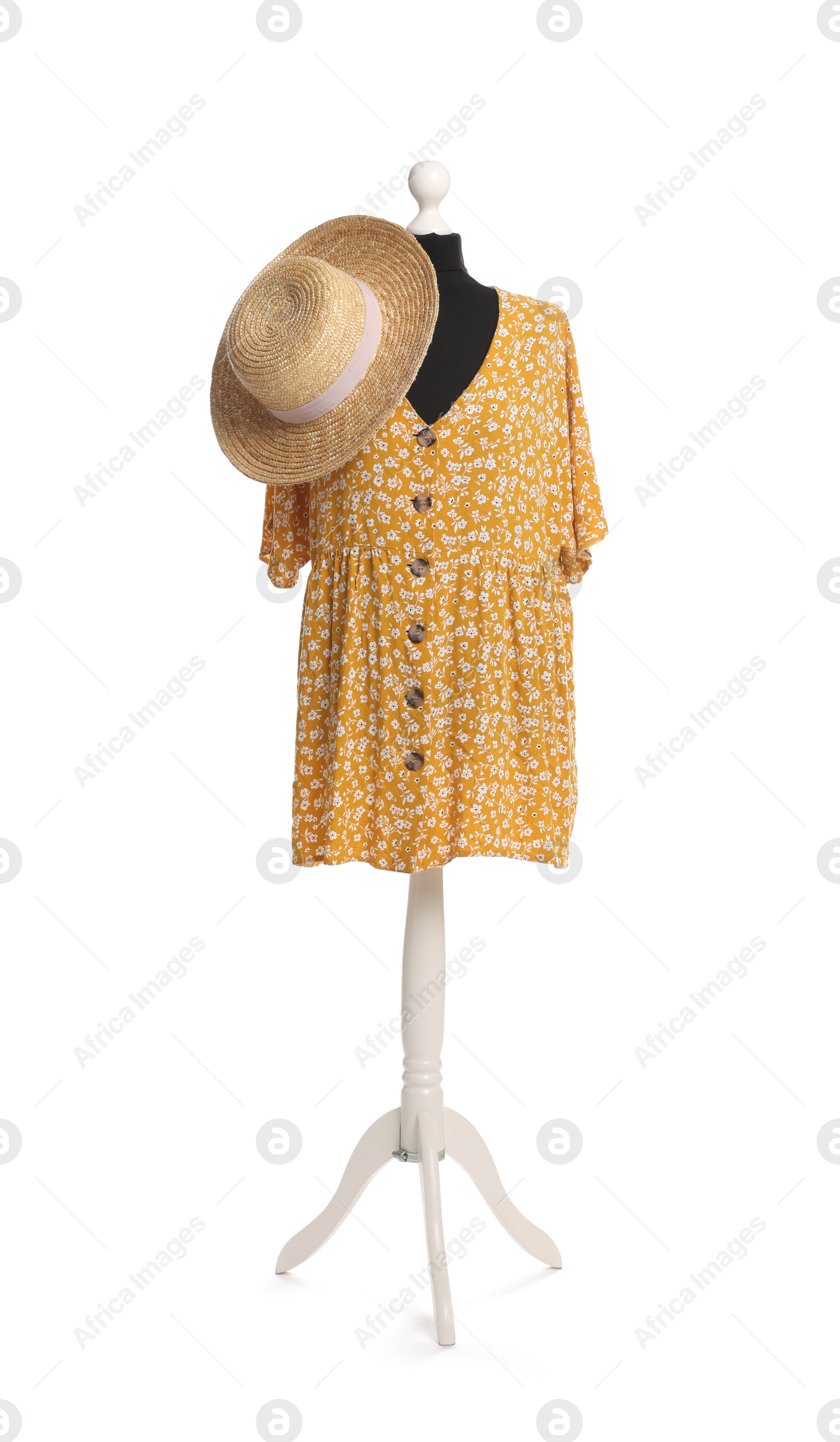 Photo of Female mannequin with stylish yellow dress and straw hat isolated on white