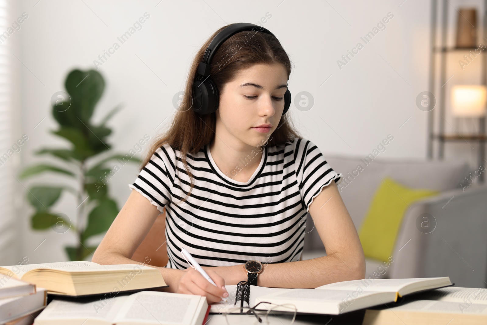 Photo of Student preparing for exam at table indoors