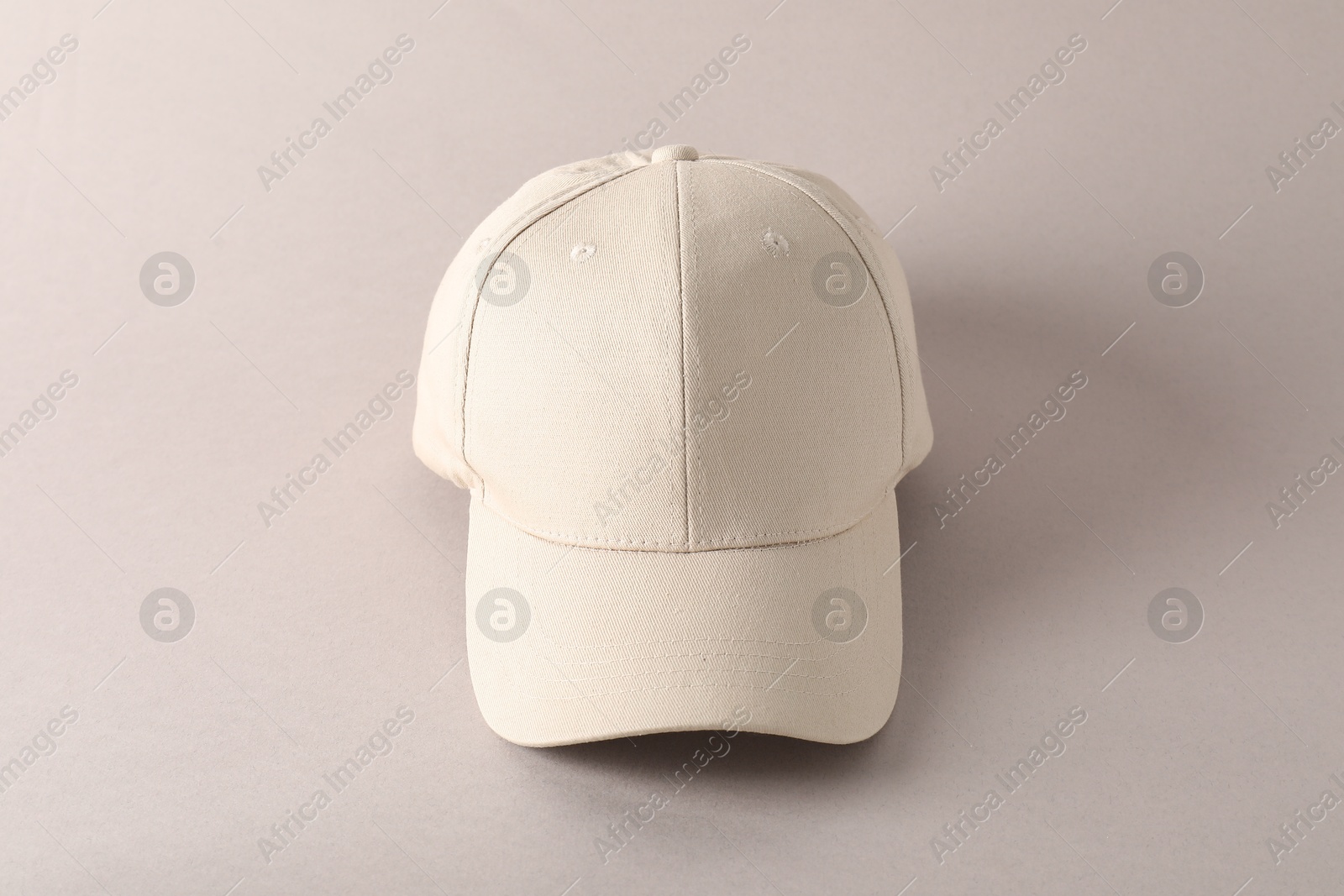 Photo of Stylish baseball cap on light grey background. Mockup for design