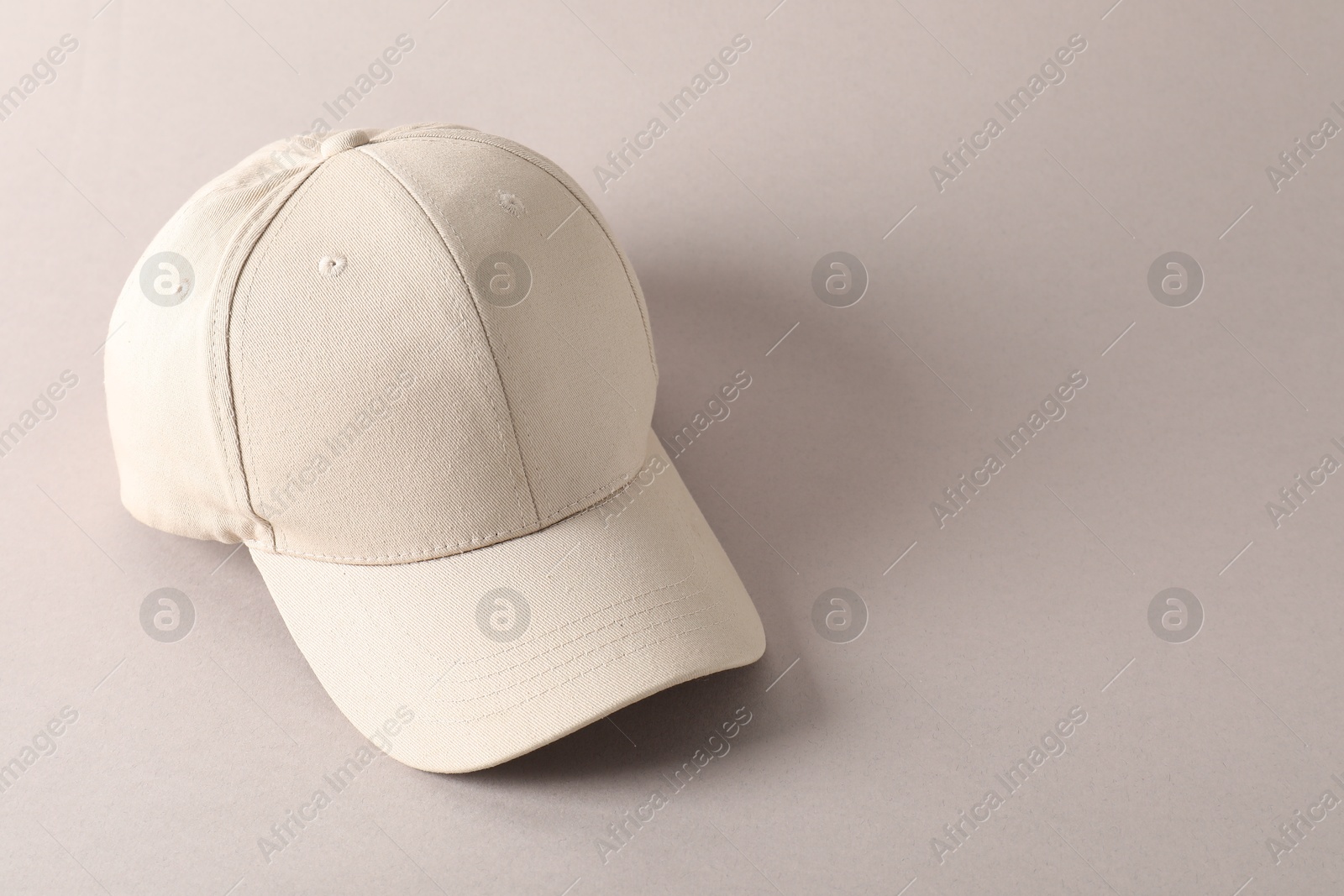 Photo of Stylish baseball cap on light grey background. Mockup for design