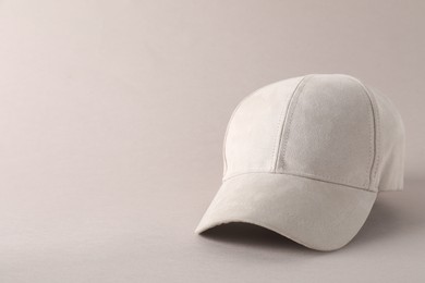 Photo of Stylish baseball cap on light grey background. Mockup for design