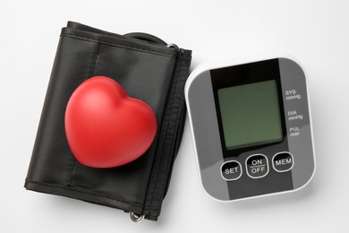 Photo of Blood pressure measuring device and squeeze heart on white background, top view