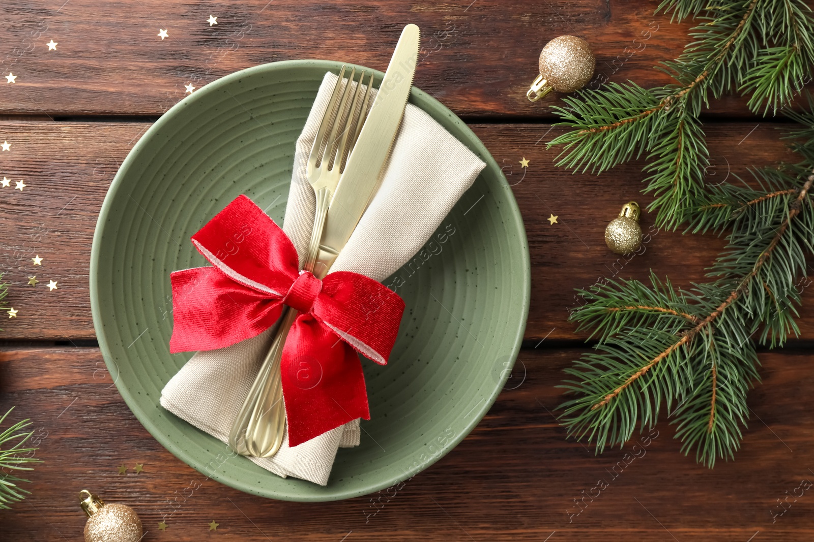 Photo of Christmas setting and festive decor on wooden table, flat lay