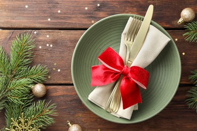 Photo of Christmas setting and festive decor on wooden table, flat lay