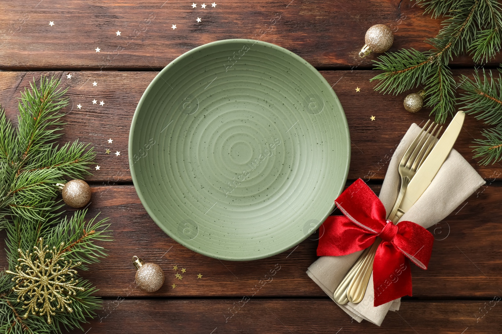 Photo of Christmas setting and festive decor on wooden table, flat lay