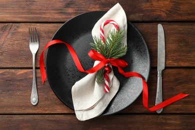 Photo of Christmas setting and festive decor on wooden table, flat lay