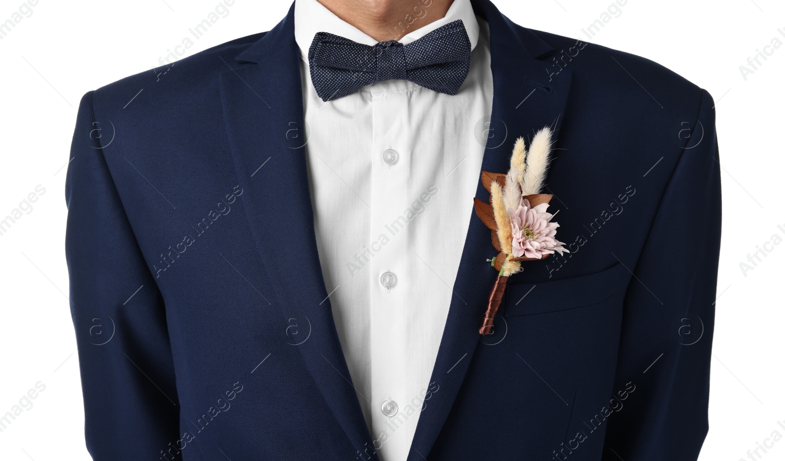 Photo of Groom in suit with stylish boutonniere on white background, closeup