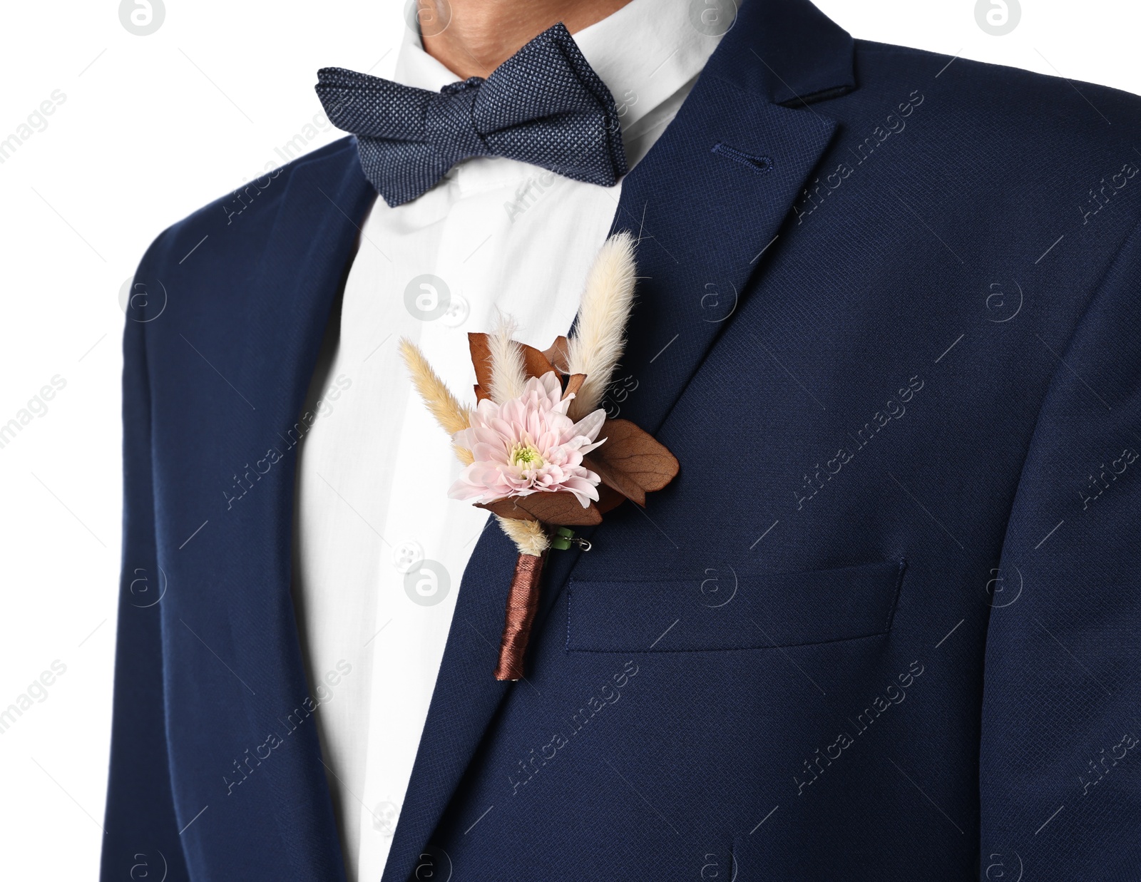 Photo of Groom in suit with stylish boutonniere on white background, closeup