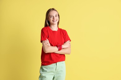 Photo of Portrait of teenage girl on yellow background