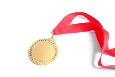 Photo of One golden medal with ribbon isolated on white