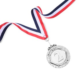 Photo of Silver medal with striped ribbon isolated on white, top view