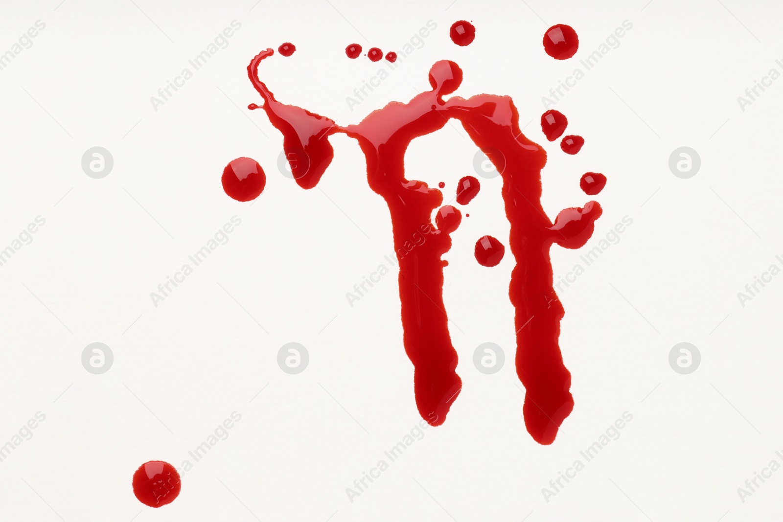 Photo of Drops of blood on white background, top view