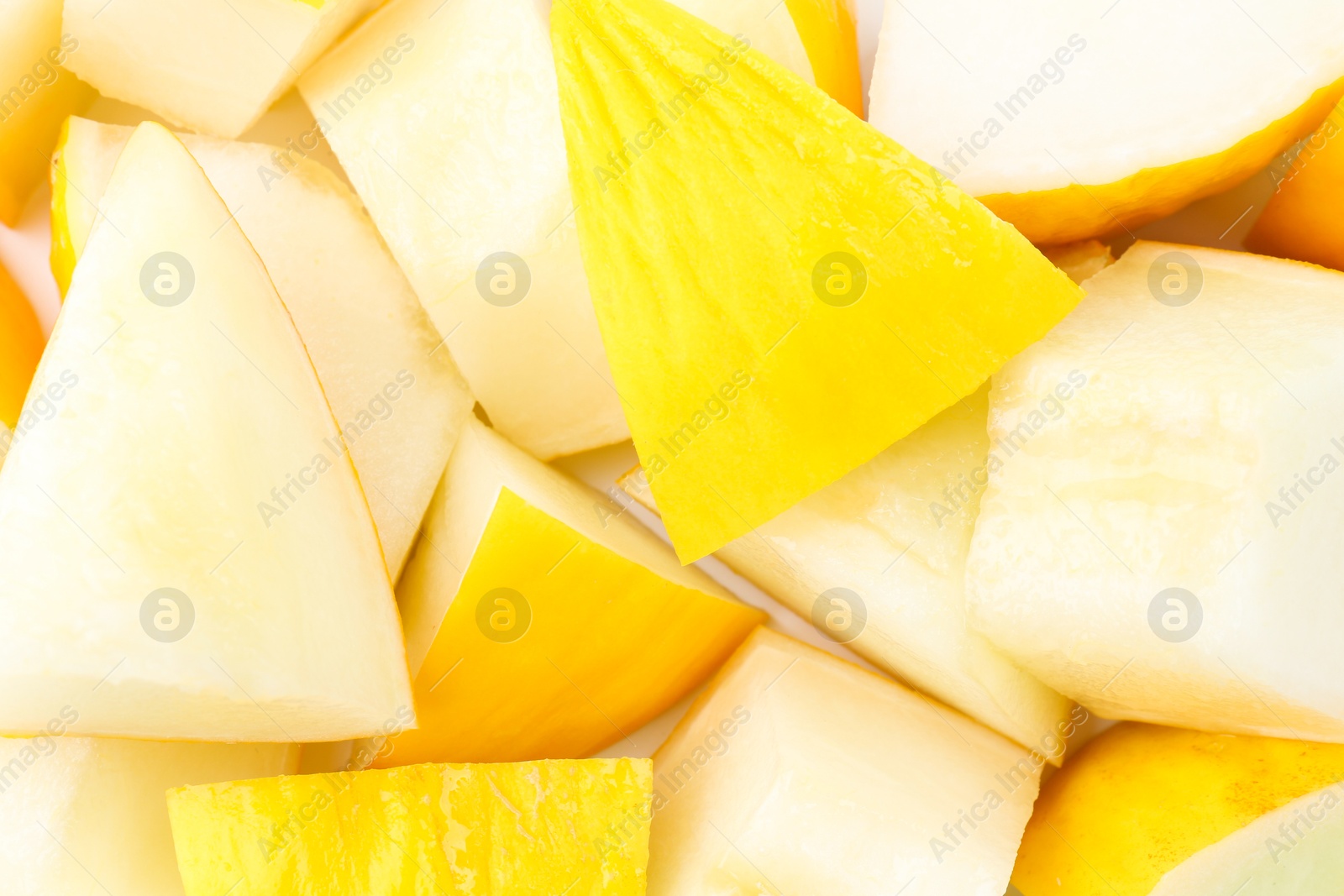 Photo of Pieces of fresh melon as background, top view