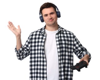 Photo of Young man in headphones with controller on white background